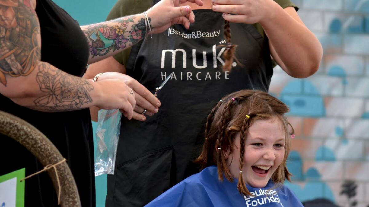 Jessica Betts from JB's Hair & Beauty took on the task of shaving Aldavilla Public School student Emma Duncan hair. Picture supplied by Aldavilla Primary School.