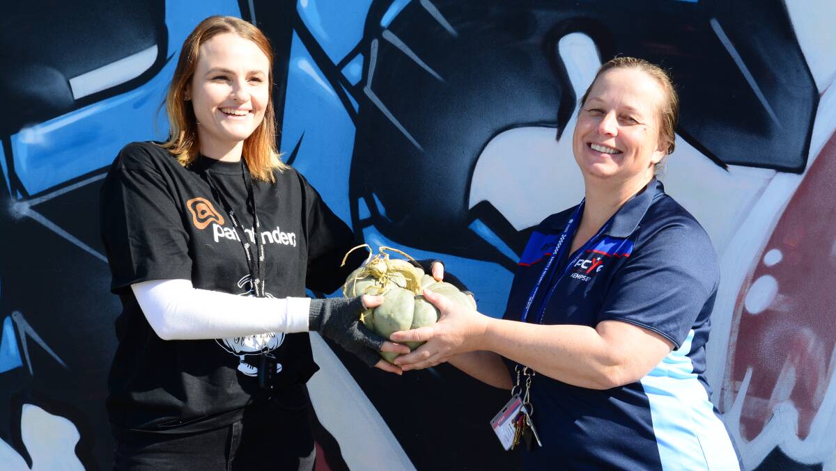 Anita Hartley, team leader at MNC Family Referral Services and Margo Clarke, manager of the Kempsey PCYC at the pumpkin handover last week 