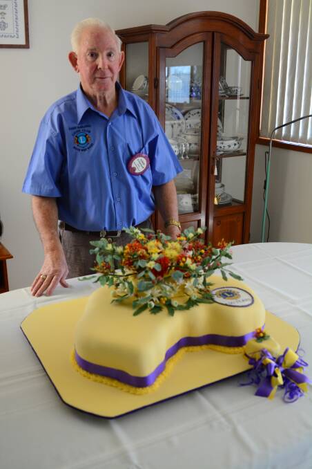 Star baker: Darby Farrawell with his cake created to celebrate 100 years of the Lions Club in Australia