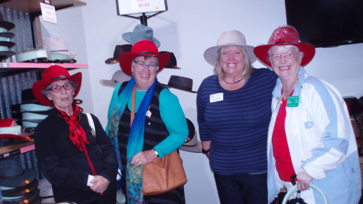 TIP OF THE HAT: Friendship Force members make the most of their trip to the Akubra hat factory.