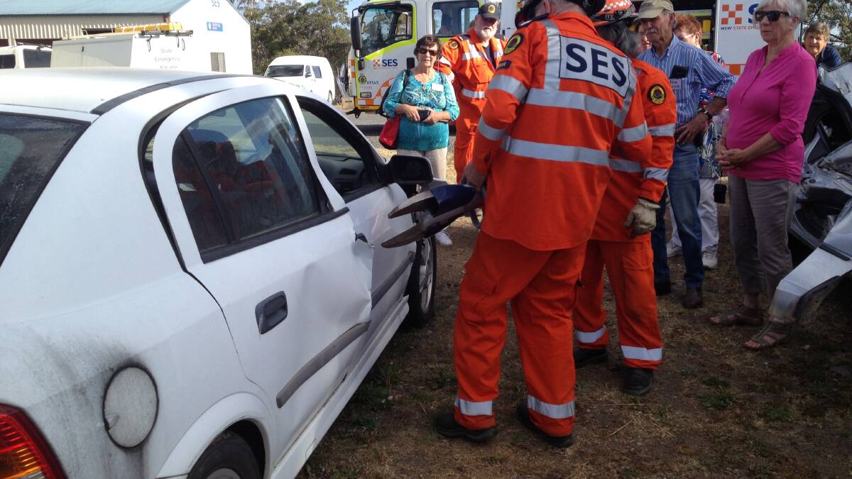 JAWS OF LIFE: Kempsey SES workers demonstrate how to rescue a person from a crushed car.