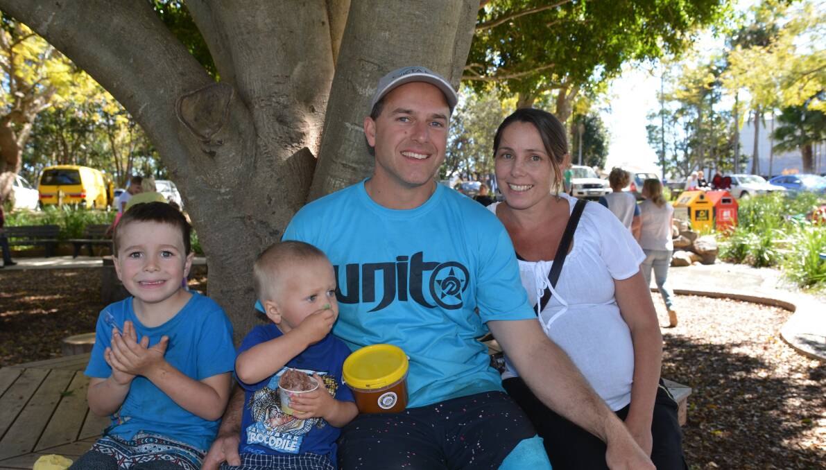 Simon and Kate Latta from Crescent Head relaxing at the markets with their children Dylan, 5 and Banjo, 2.