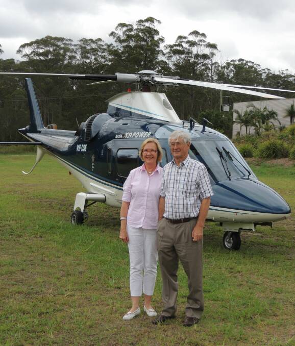 AUSSIE ICON DROPS IN: Patrons of the Slim Dusty Centre, Dick and Pip Smith, landed their helicopter out the front of the centre, stopping to chat with local fans before being taken on a tour. Photo by Geordie Bull.