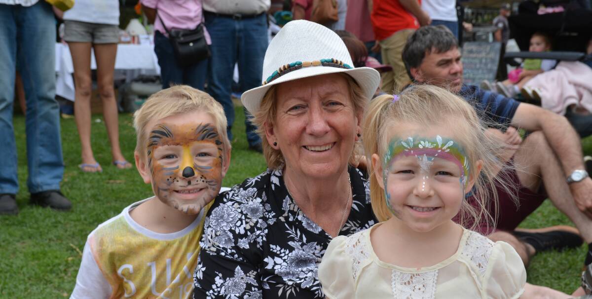 Sonja Young and grandchildren Darby and Ivy Hudson had fun having their faces painted at the festival. Photograph by Penny Tamblyn.