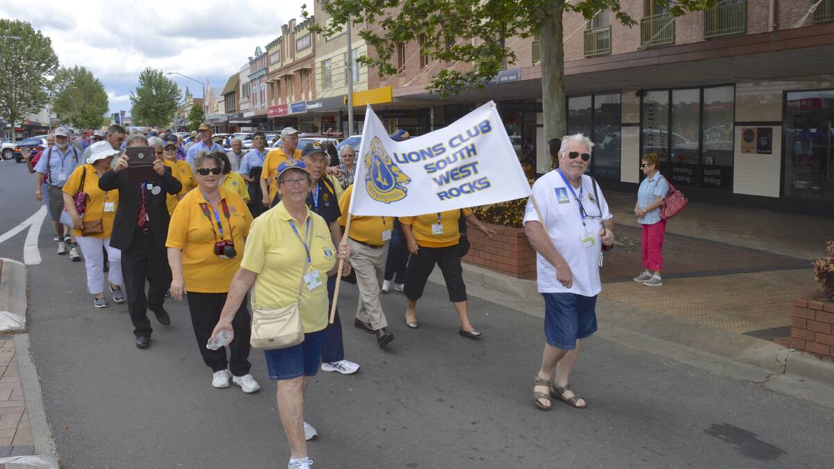 Lions members marched through the street in Inverell on Saturday, then wore fancy dress for Saturday night's banquet at the district convention in Inverell.