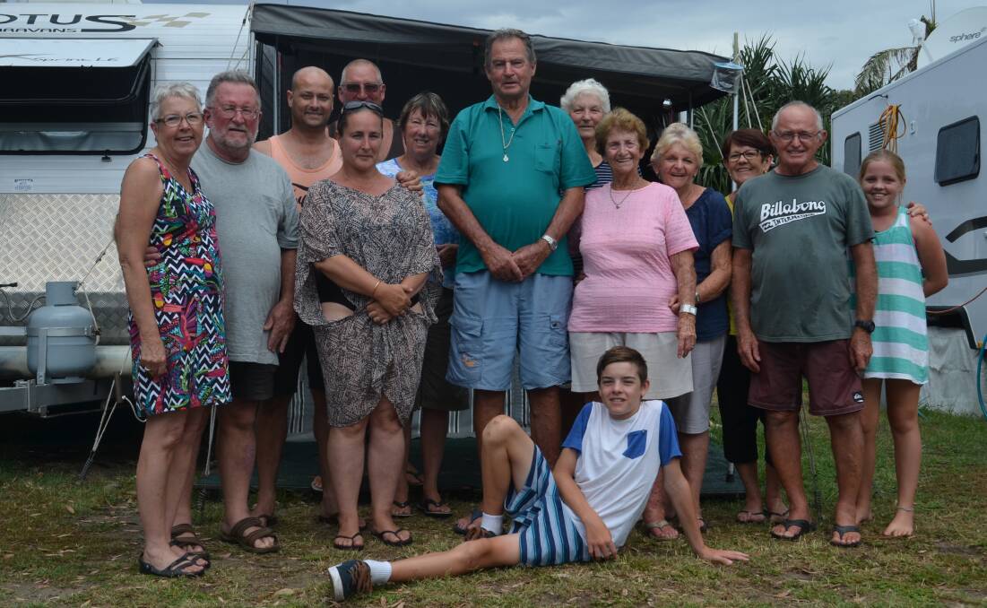  Community spirit: Dick (green shirt) and Tamar (pink) Hooey celebrate 50 years at Crescent Head. They're surrounded by fellow holidaying friends. Photo: Lachlan Leeming. 