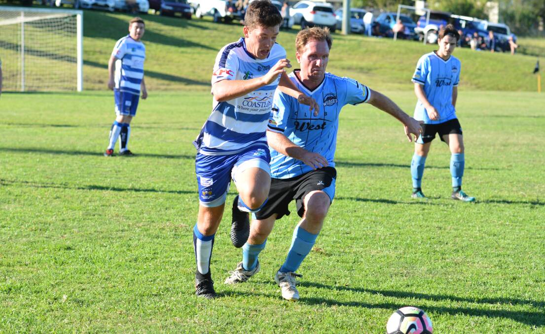 The Rangers' Daniel Saul attempts to outpace a Taree opponent in their weekend match. 