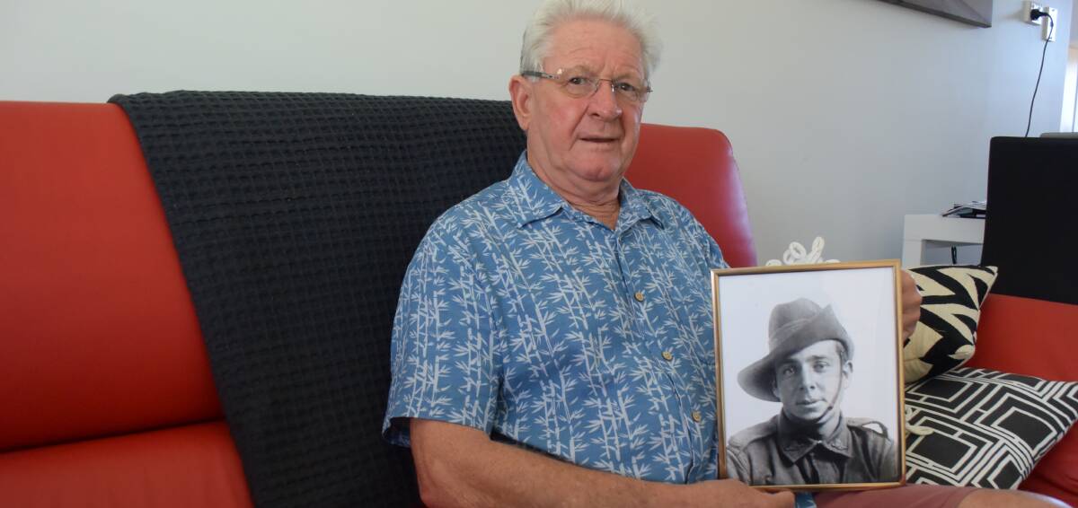 A young life lost: Col Barnett with a picture of his great-uncle William Charles Woods, who died on the Western Front in WWI. Photo: Lachlan Leeming. 