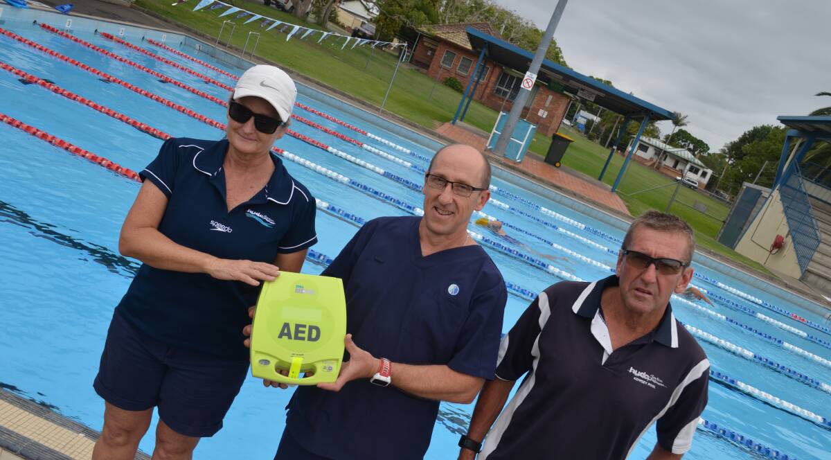 Lifesaver: Kempsey Swimming Pool's Heather and Tony Hudson, with MNCDI Kempsey's Martin Bennie (centre). Photo: Lachlan Leeming.  