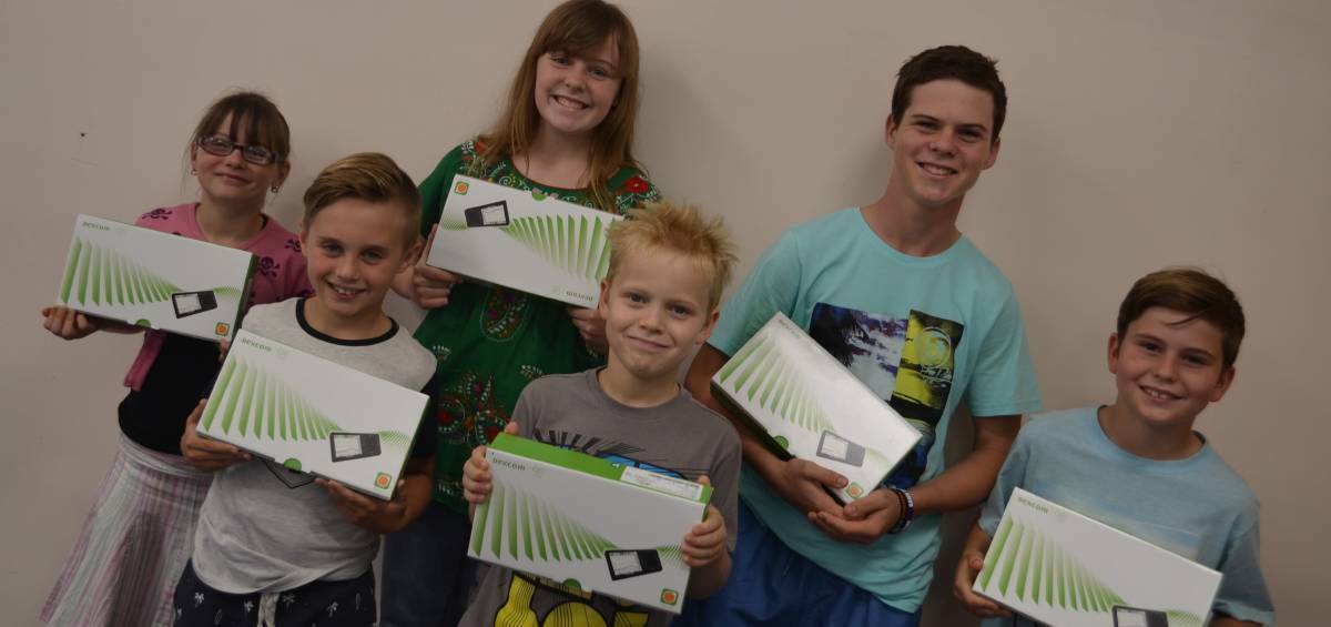 Macleay diabetes patients Ebony, Jacob, Harriet, Flynn, Jack and Connor hold their new continuous glucose monitoring units earlier this year.