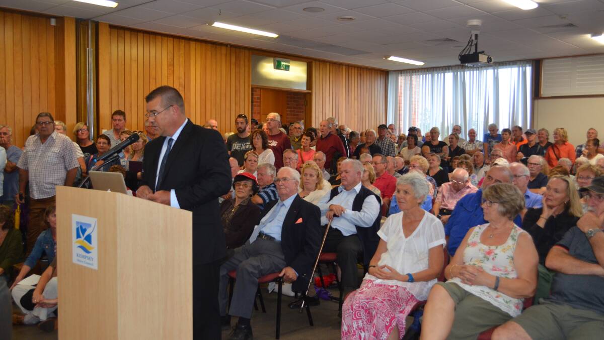 Standing room only: Adam Ulrick, representing the Save Kempsey Airport organisation, speaks in front of a crammed council chamber. 
