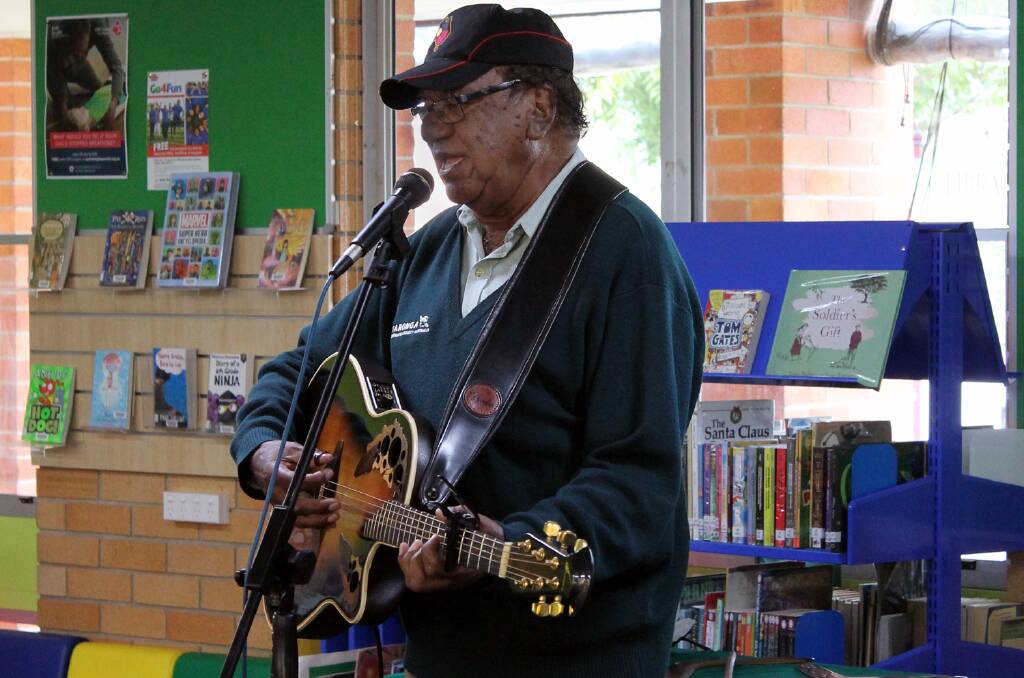 Learning through song: Aboriginal elder Col Hardy sung and told stories for the attentive Kempsey kids. Photo: Supplied.