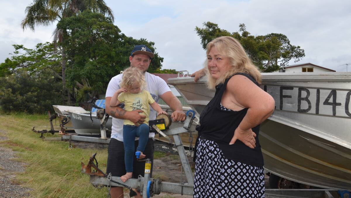 End of the line: Donna Cook, her son Jamie and his son Kayden at their Stuarts Point home. The Cooks have fished the Macleay for five generations, spanning more than 100 years. Photo: Lachlan Leeming.