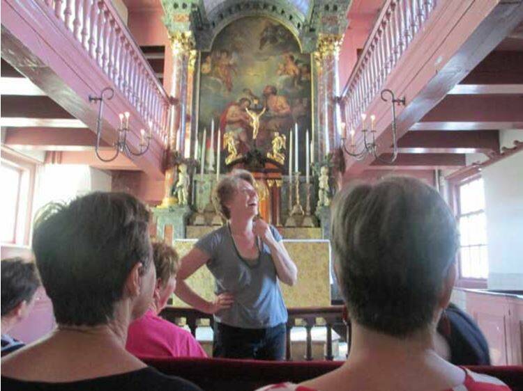 Stunning: In the museum church Ons Lieve Heer op Solder the 2014 tour has its first singing session with Rachel Hore on the first stop in Old Amsterdam.