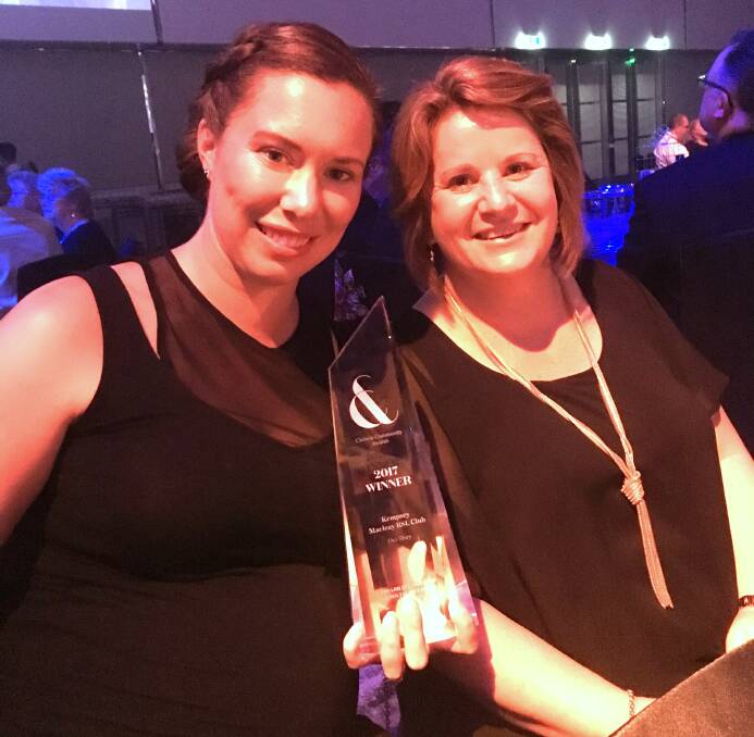 WINNERS: Bianca Hopper (left) and Lisa Roberts (right) hold the winning trophy at the Clubs and Community Awards held on Sunday 15 October at the International Convention Centre in Darling Harbour, NSW.