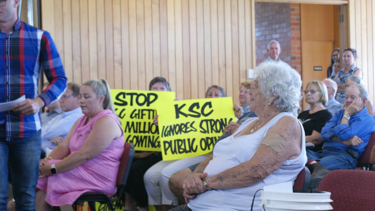 Protest signs read: 'KSC ignores strong public opinion' and 'Stop gifting Gowings $2 million'.