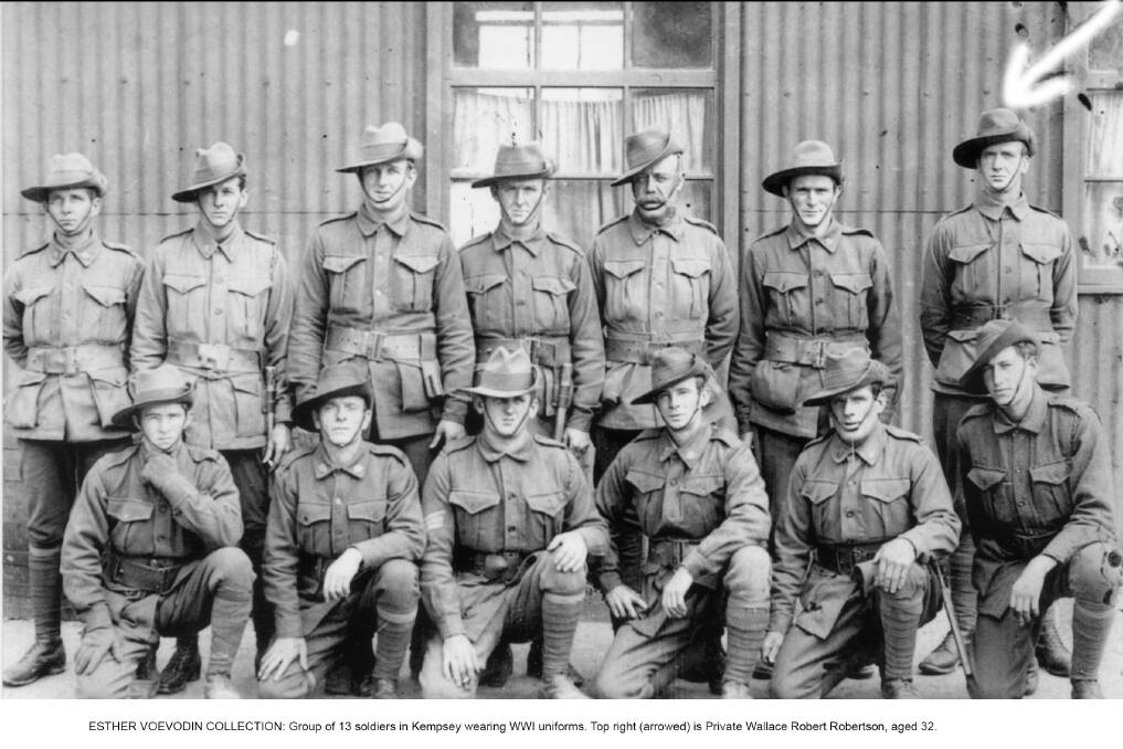 ESTHER VOEVODIN COLLECTION: Group of 13 soldiers in Kempsey wearing WWI uniforms. Top right (arrowed) is Private Wallace Robert Robertson, aged 32.