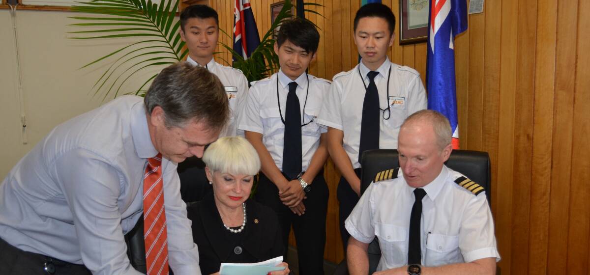 Kempsey Shire Council's general manager David Rawlings, mayor Liz Campbell and Australian International Aviation College chief flying instructor Kevin McMurtie with three pilot's in-training. 