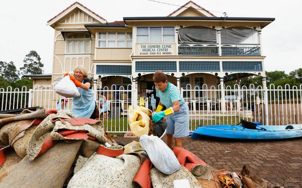 Residents help to clean up the Lismore Medical clinic on April 2, 2017 in Lismore following the flood caused by the aftermath of Cyclone Debbie. Photo: Jason O'Brien/Getty Images.