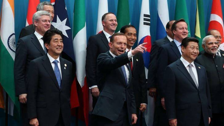 Prime Minister Tony Abbott poses with the G20 leaders for the family photo in Brisbane. Photo: Andrew Meares