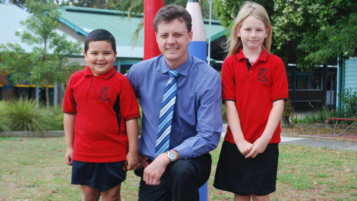 Set for a boost: Kempsey South Public School students Tahquin Asake-Furner (left) and Indiana Davis-Oshea with principal Andrew Kuching. The school has received and anonymous donation of $200000.