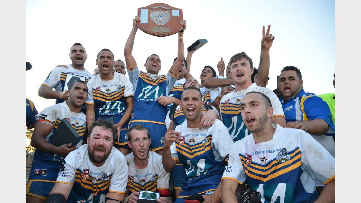 Happier days: The Macleay Valley Mustangs celebrate their 2014 Group 3 premiership win in September.