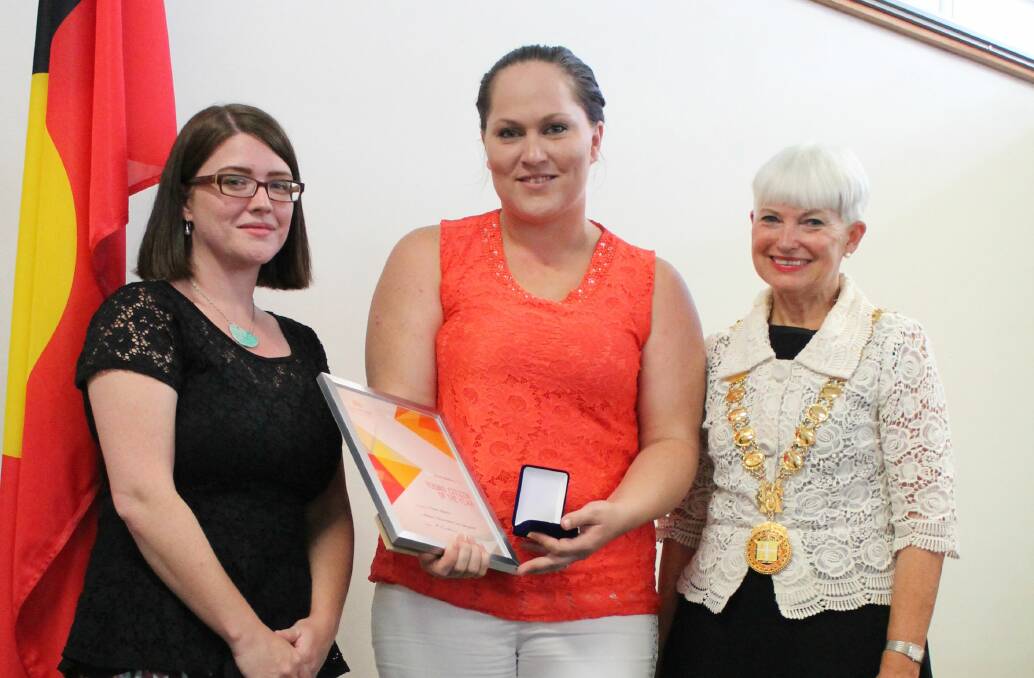 Well earned: Kempsey's Young Citizen of the Year Claire Martin receives her award from mayor Liz Campbell and Australia Day ambassador Claire Tonkin