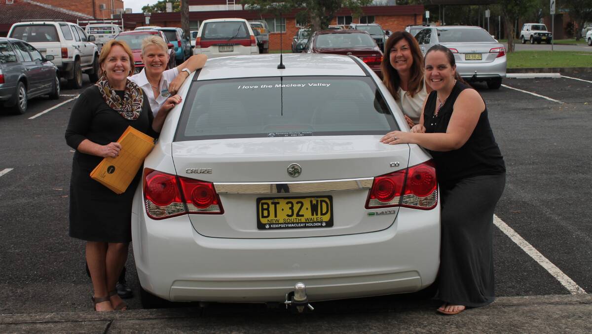 Positive promotion: Kempsey Shire Council’s Jenny Colling, Julie Woodrow,  Melissa Killmore and Macleay Argus manager Shellie Morrison with one of the ‘I Love the Macleay Valley’ stickers.
