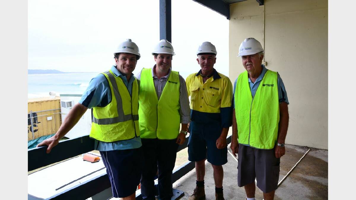 Great view: Kempsey-Crescent Head Surf Lifesaving Club captain Scott Edwards, builder Ben O’Donnell, site manager Brett Berrigan and
surf club secretary Maurie Fuller in the old clubhouse this week. Work has started on knocking it down. Picture by Todd Connaughton