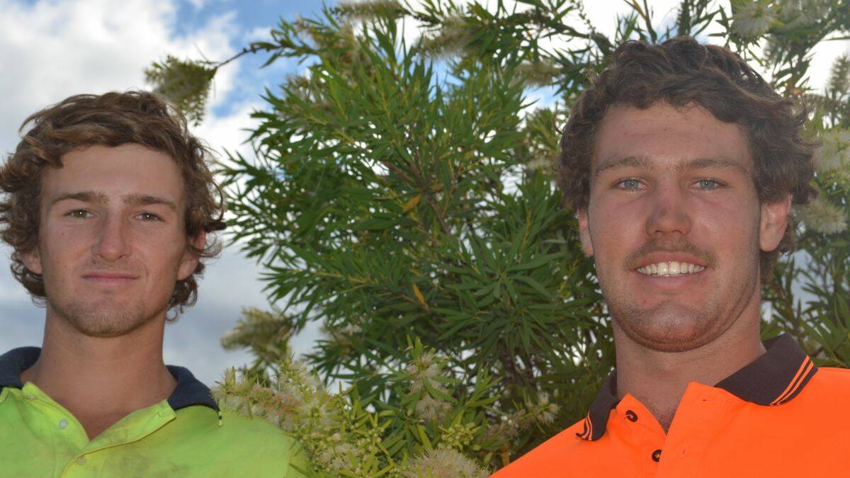 Surfers Ricky Thomas and Anthony Adams helped save two men on Tuesday morning after their boat smashed onto rocks at Crescent Head.