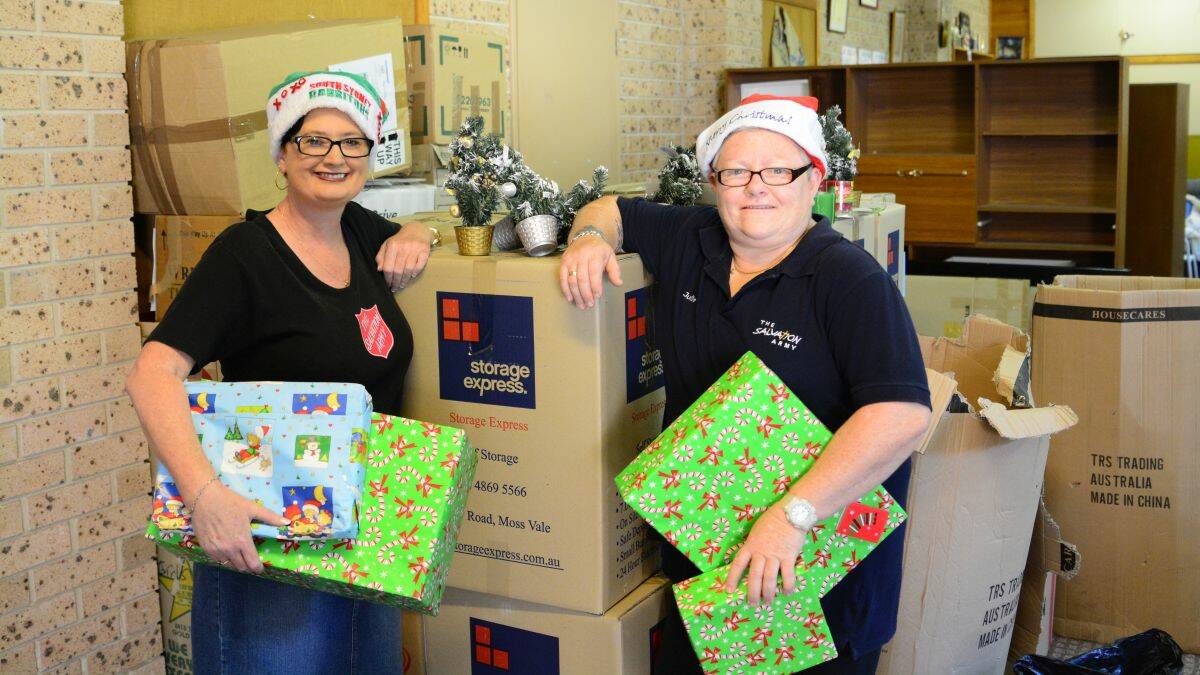 Growing demand: Captain Karen Keddie and volunteer Julie Linton sort through the presents for their annual Christmas appeal