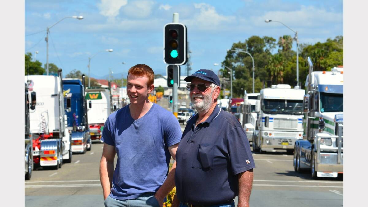 Welcome back: Bill Low (right) watching the truck parade with his grandson, Ben Jenkins. The Argus photographed Mr Low in a
similar location in Belgrave St last year. The parade of trucks and people finishes at the Truck Show