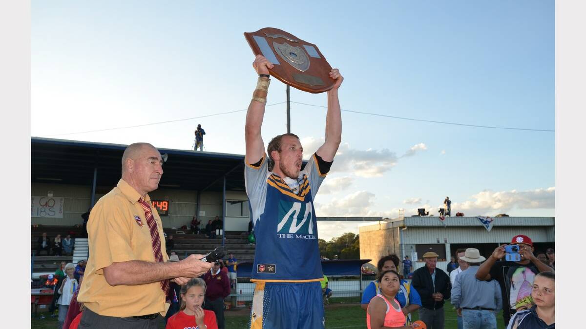 Not so long ago: Macleay Valley Mustangs first grade caption Sam Howe proudly raises the Group 3 shield after the club’s grand final win in September