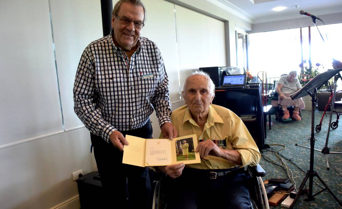 Kempsey's deputy mayor Lou Kesby and Macleay Valley house resident Ted Pascoe with his telegram from the Queen congratulating him on his 100th birthday
