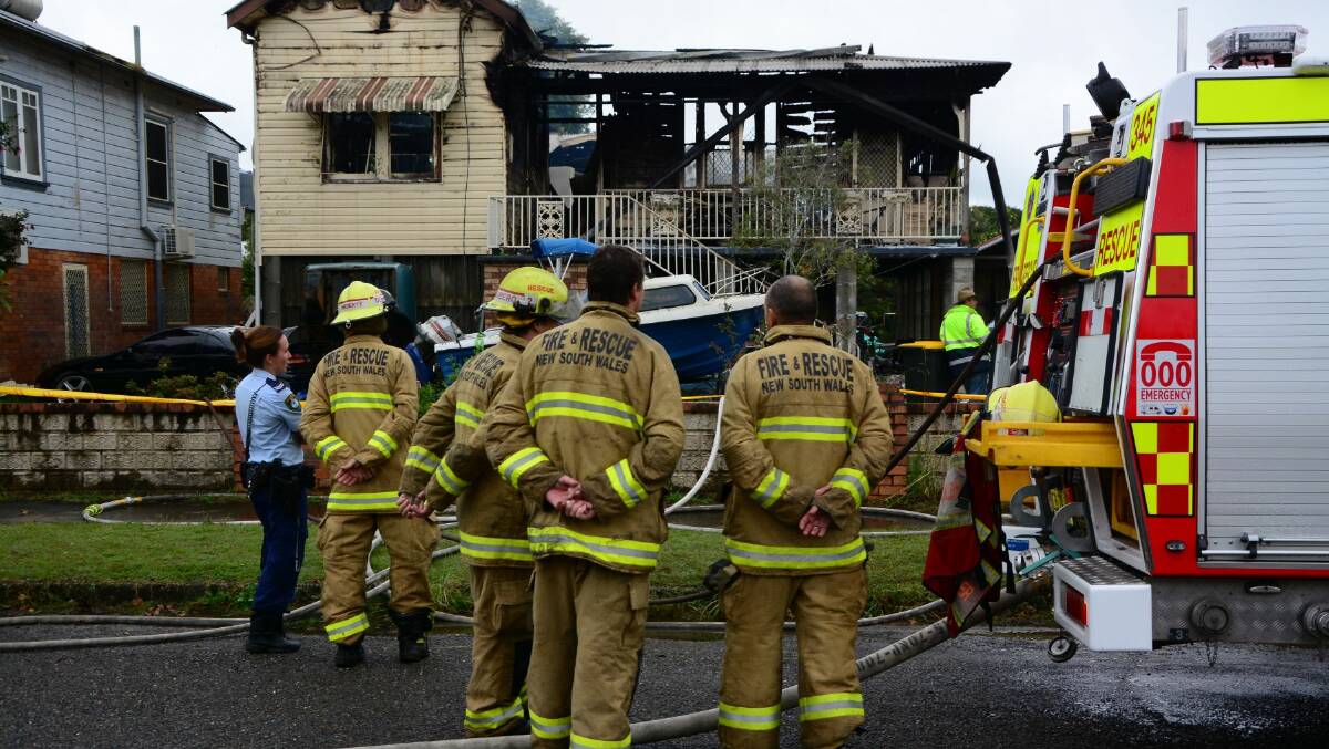 Police and Fire and Rescue NSW at the burnt out house yesterday