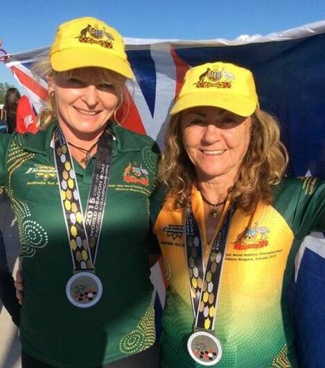 
Mignon Piper and Shirley Baines with one of the silver medals they both won with the Australian team at the 12th World Dragon Boat Racing Championships in Canada 