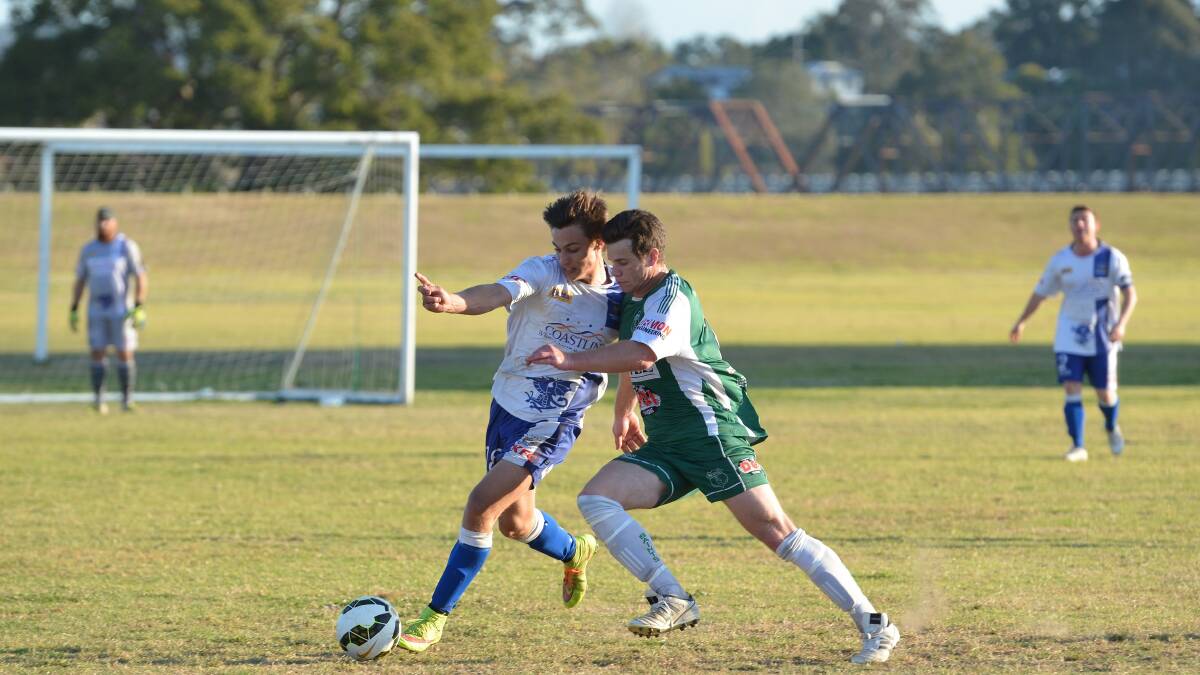 Tough match: Rangers’ Michael McCarthy and Saints’ Blake Webster fight it out for control of the ball in last week’s game 