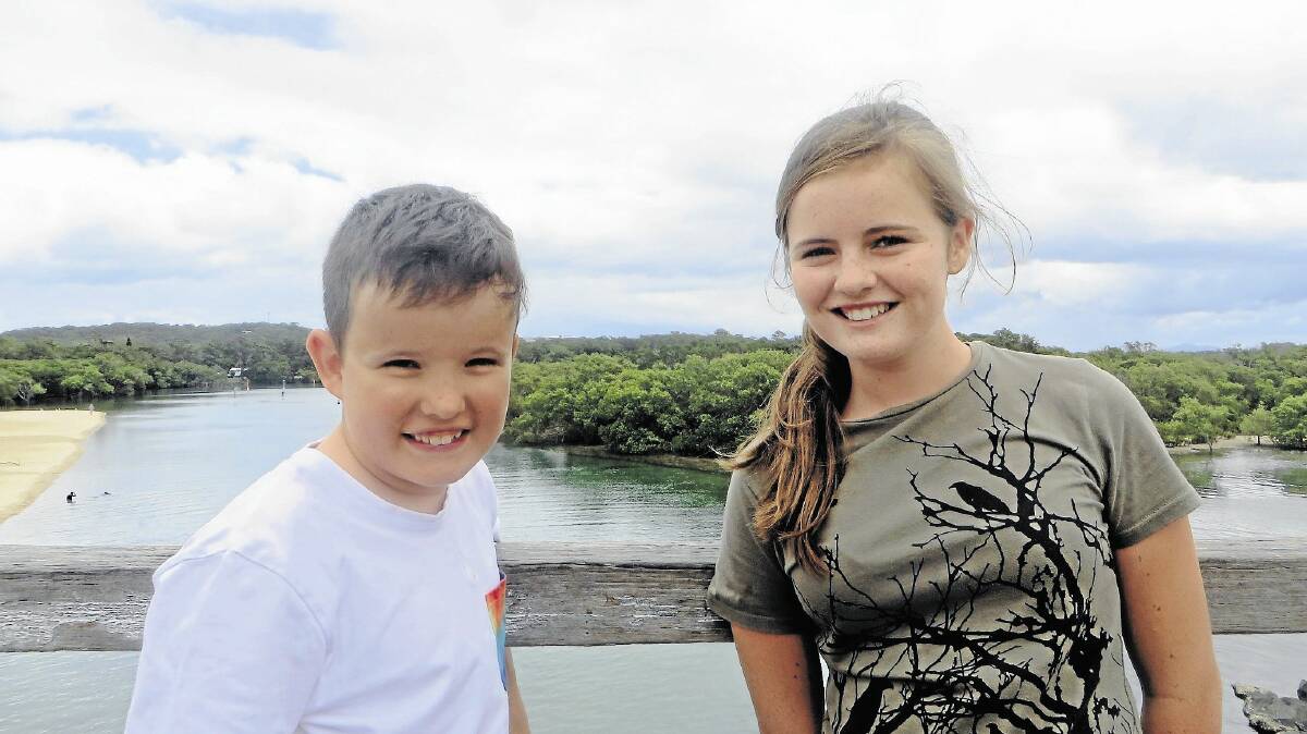 Matthew Jackson with his cousin Annie Paterson from Canberra on the bridge.
Inset: The footbridge at Back Creek at South West Rocks 