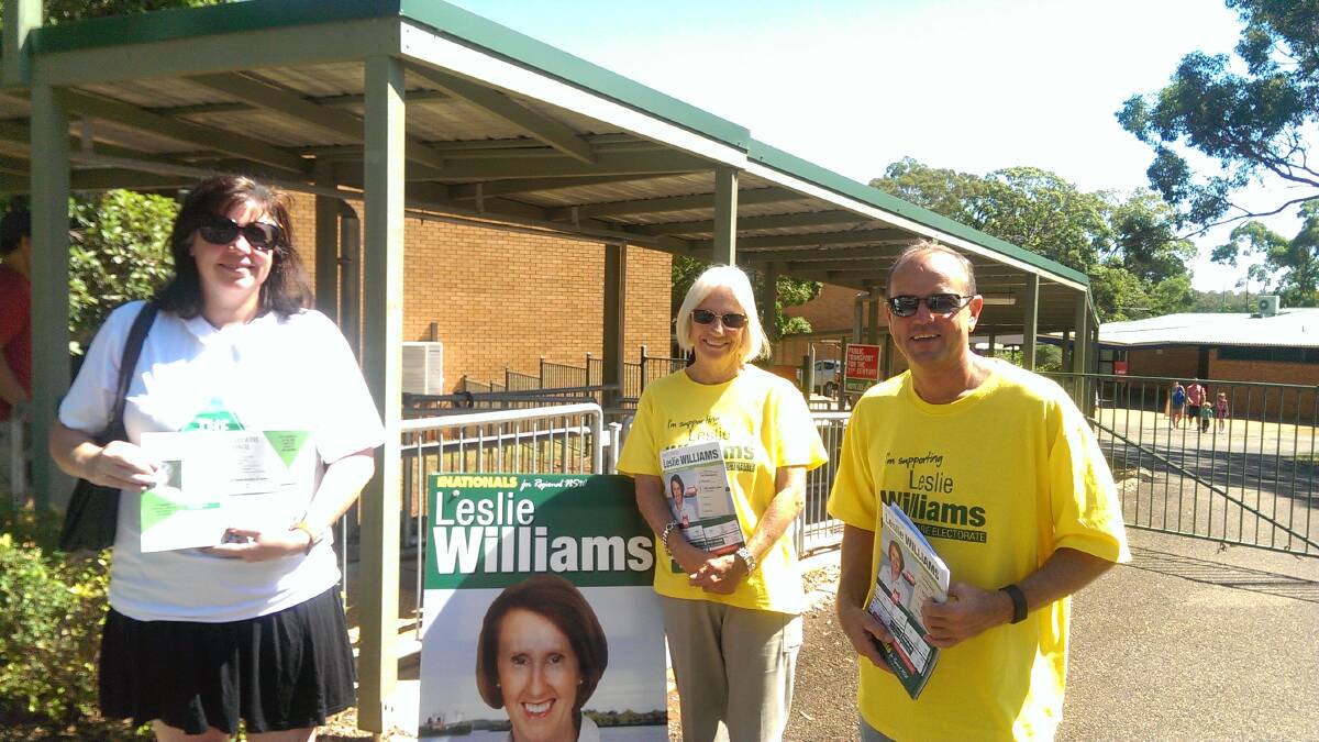 Volunteers Cara Starr (The Greens) and Ronda Laws and Jim Pearson (The Nationals) hand out how to vote material at Hastings Secondary College Westport Campus. Pic: Lisa Tisdell