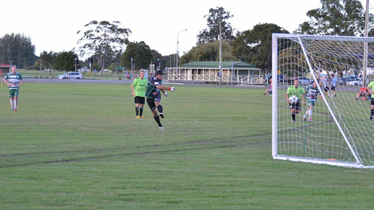 Rescue job: Kempsey Saints goalkeeper Jacob Lyttle fired home a late equaliser from the penalty spot against 2013 grand finalists Wallis Lakes. Photos by Penny Tamblyn