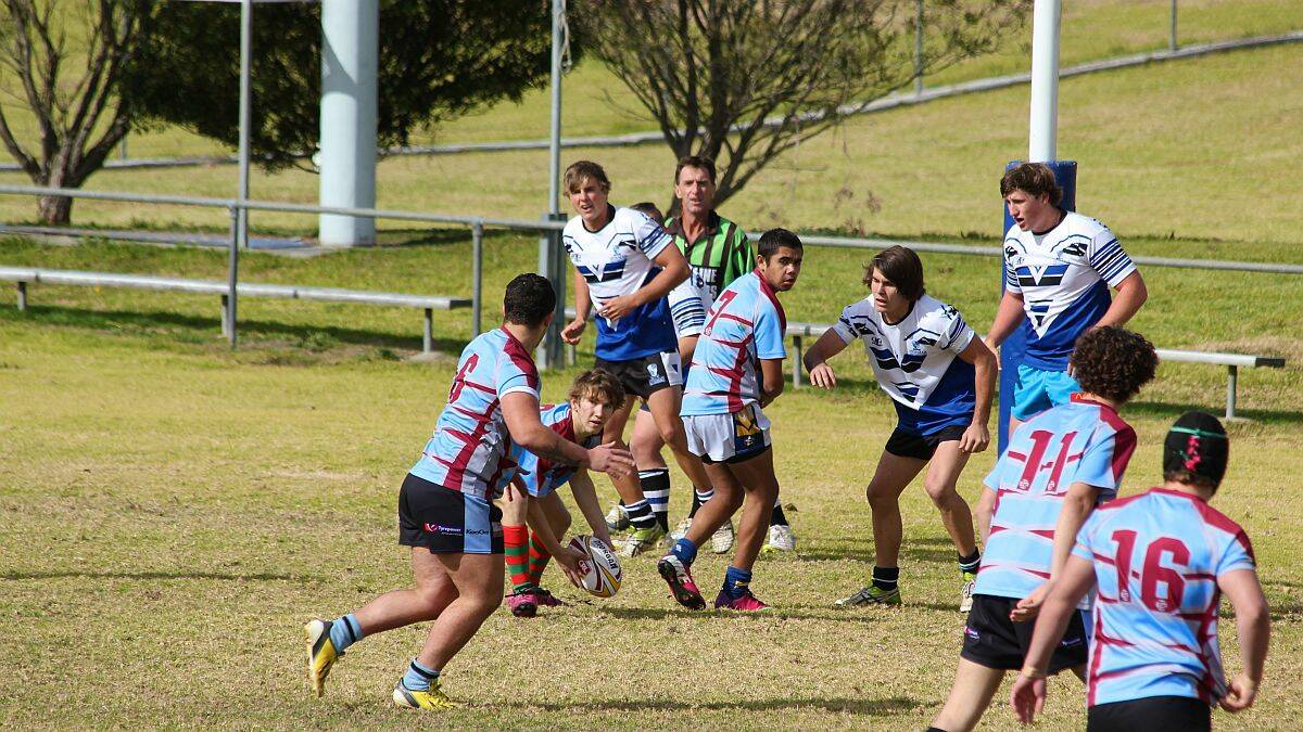 End of the road: Melville High School opens team hooker Aaron Sutherland offloads to five-eighth Reece McPhillips in the Mid North Coast final. The Kempsey side made a brave fist of it at the Northern NSW finals earlier this week.