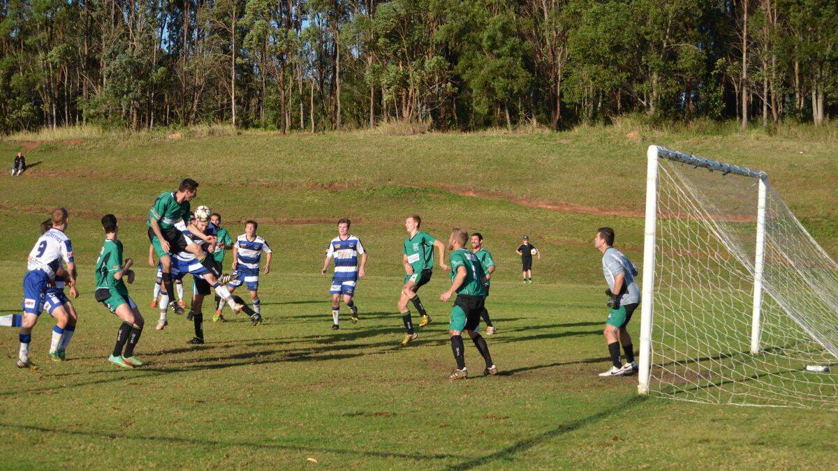 Right time, right place Jeremy Masters squeezed between two defenders for Macleay Valley Rangers' late winner.