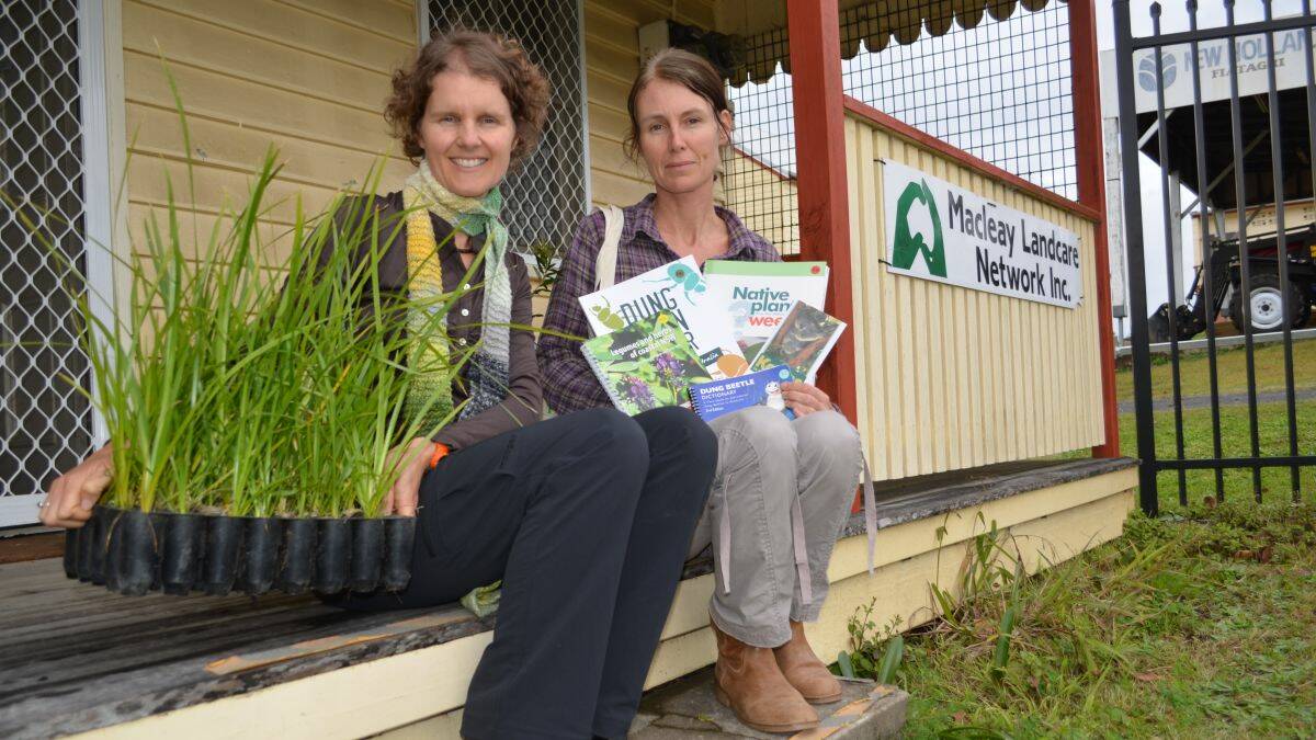 Go native: Macleay Landcare Network’s Sharon Cunial and Natasha English with some of the items available at this weekend’s Tree and Produce Fair.