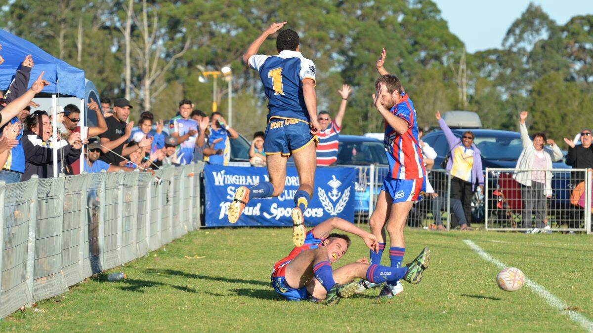 q Athletic effort: Macleay Valley Mustangs fullback Jeremy Taylor leaps high in celebration after a try, in his side’s defeat to Wauchope Blues on Sunday. He had just caught a loose ball over the try line and managed to ground it just inside the dead-ball line. Photo - Penny Tamblyn.