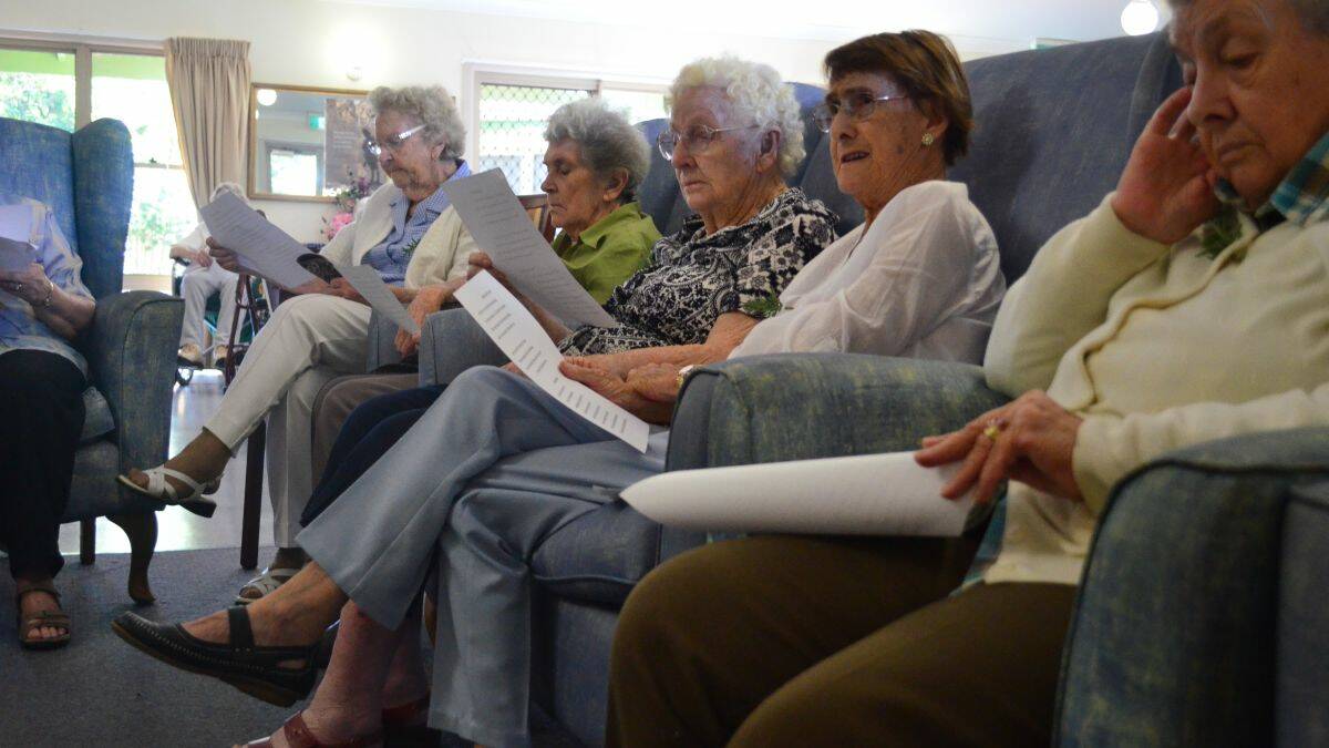 United in song: Cedar Place residents joined in the singing of hymns.