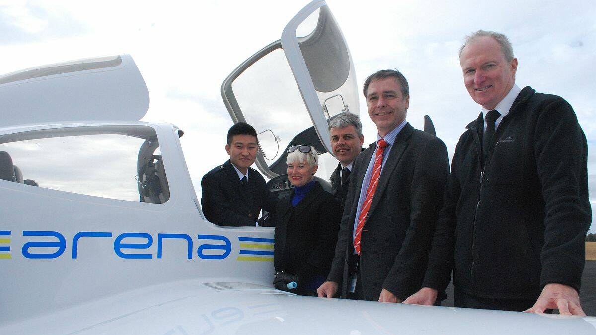 Flying high: Chinese trainee pilot Li Yu; mayor Liz Campbell; Jamie Johnston of Arena International Aviation College; Kempsey Shire Council general manager David Rawlings and Andrew McMurtrie, of Arena, attended the launch of the new pilot training school at Aldavilla this morning.