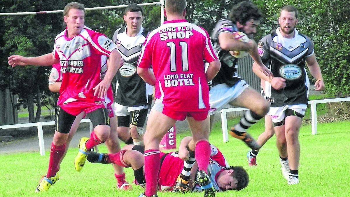 Winning ways: Wade Keogh breaks free for the Magpies in their defeat of the Long Flat Dragons