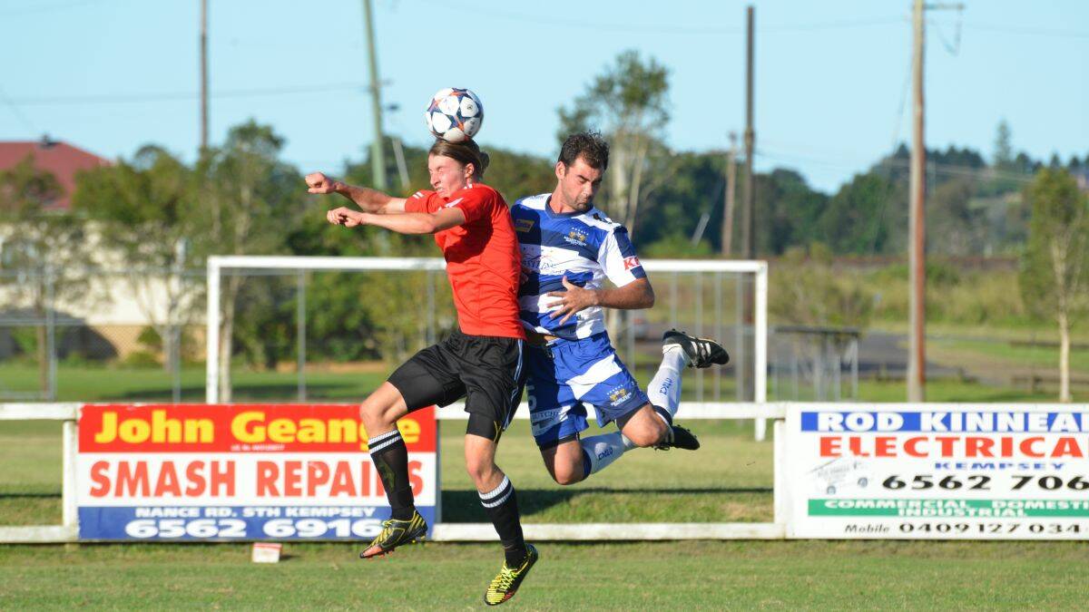 Three points: Macleay Valley Rangers defender Brent Ryan (right) makes an aerial challenge during his side’s win over Port Saints last Saturday. Photos by Penny Tamblyn