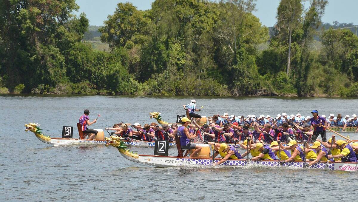 Rats on the River: The Kempsey Macleay River Rats (nearest to camera) compete in the Australia Day Regatta at Manning River. Photo: Manning River Times
