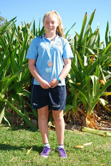 Strong competitor: St Paul's High School student Jessica Grant proudly wearing the bronze medal she won at the NSW All Schools swimming carnival in Sydney.